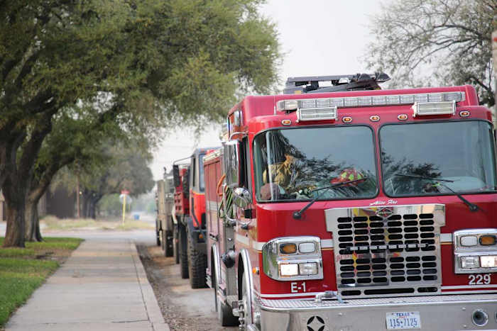 Volunteer firefighters prepare to depart Premont to battle the Borrega Fire on Thursday, March 31, 2022. Premont Fleet Fire Trucks